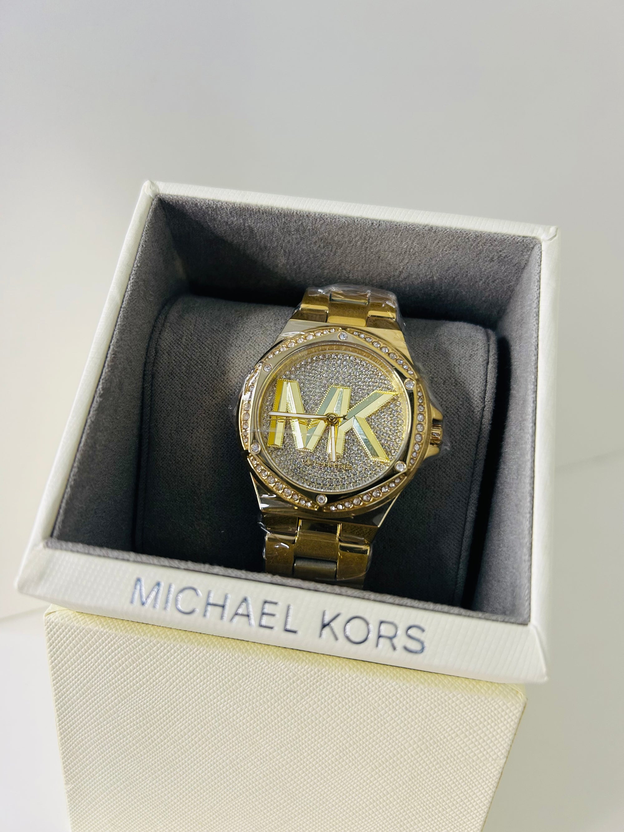 montre michael kors lennox dorée pavée mk